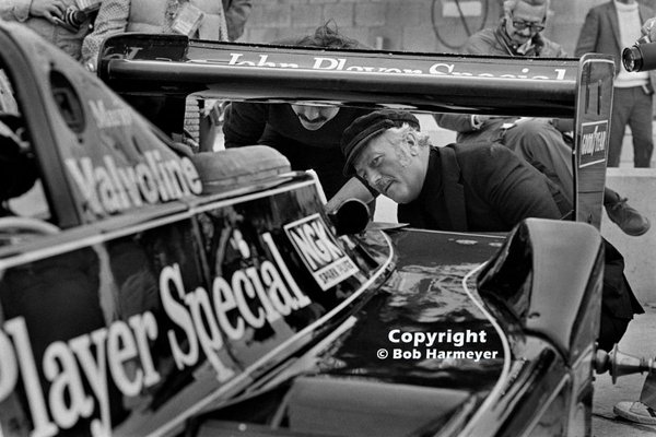 1978 United States Grand Prix East at Watkins Glen - Colin Chapman inspects the back of Mario Andretti’s Lotus 79 in the pit lane before practice.jpg